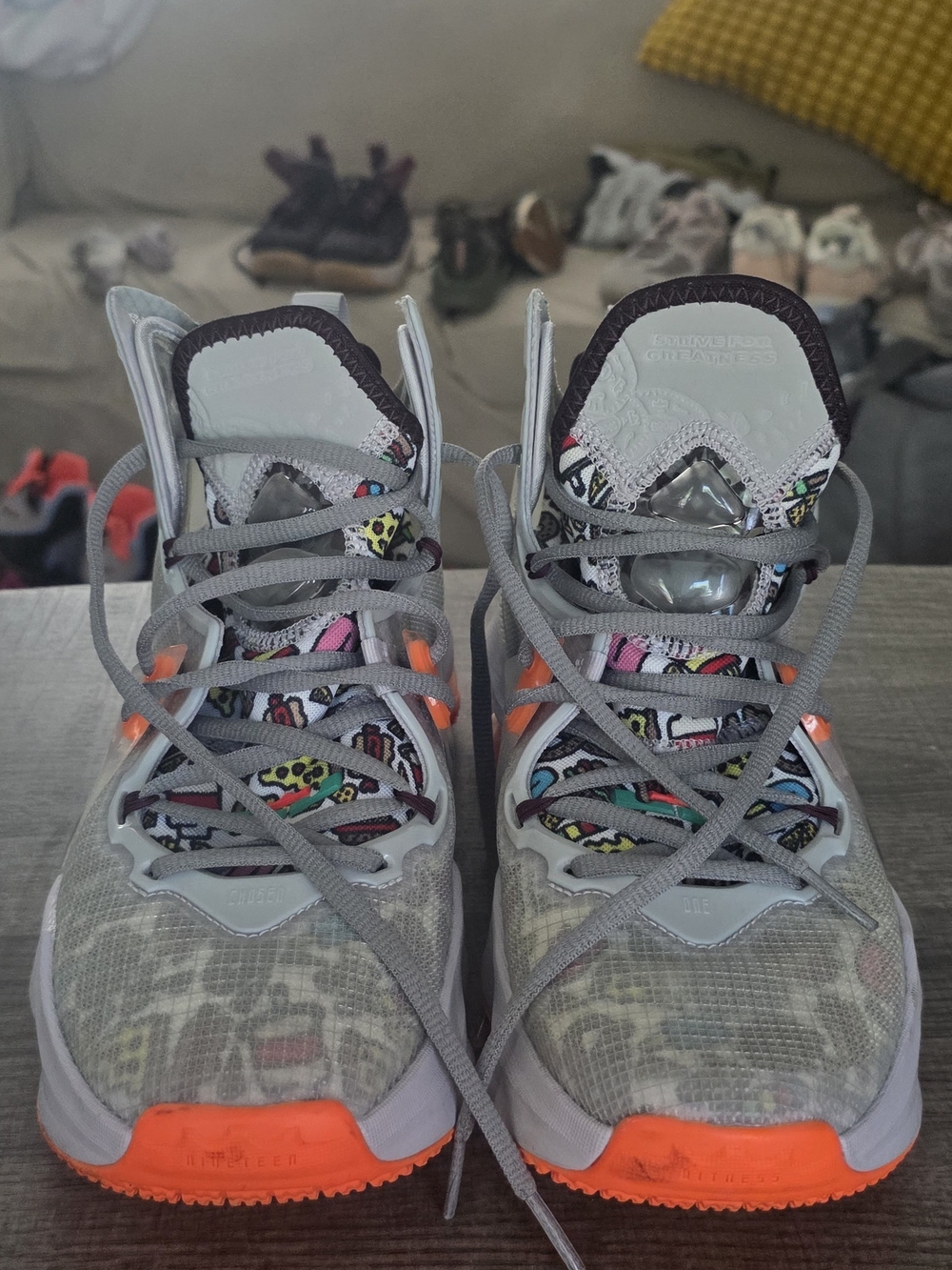 Nike Kids Gray Sneakers with Bright Orange Accents and Multicolor Pattern